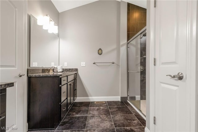 12110 Cora Ct, Concord, OH 44077 - bathroom with vanity, a shower stall, vaulted ceiling, and marble finish flooring