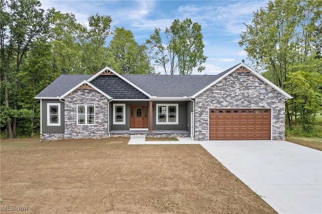 4720 Ashmont Ave SW, Canton, OH 44706 - craftsman inspired home with stone siding, a porch, an attached garage, concrete driveway, and a shingled roof