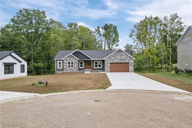 4720 Ashmont Ave SW, Canton, OH 44706 - view of front facade with stone siding, concrete driveway, an attached garage, and a front yard