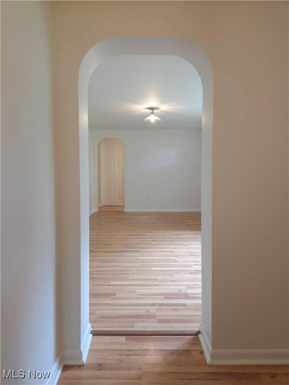 4581 Smith Stewart Rd, Vienna, OH 44473 - hall with arched walkways and light wood-style flooring