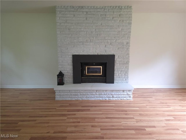 4581 Smith Stewart Rd, Vienna, OH 44473 - detailed view of wood finished floors and a fireplace