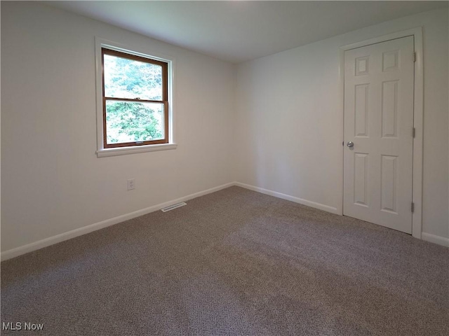 4581 Smith Stewart Rd, Vienna, OH 44473 - spare room featuring carpet and baseboards