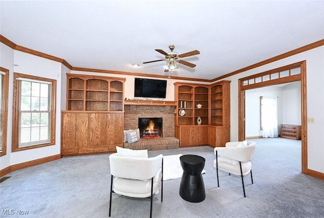 452 Herbert Rd, Akron, OH 44312 - living room with crown molding, carpet floors, a ceiling fan, and a fireplace