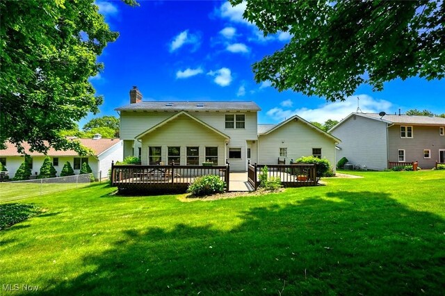 452 Herbert Rd, Akron, OH 44312 - rear view of house featuring a wooden deck and a chimney