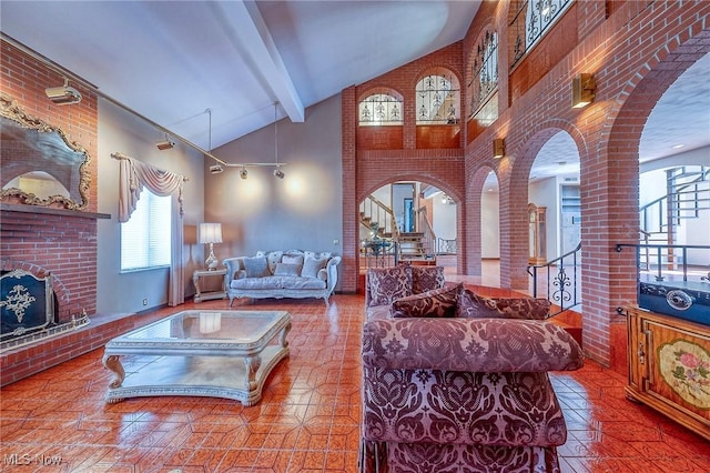 68 Caravel Pl, Wintersville, OH 43953 - living room with high vaulted ceiling, arched walkways, a fireplace, beam ceiling, and stairway