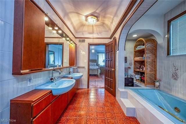 68 Caravel Pl, Wintersville, OH 43953 - full bath with a whirlpool tub, vanity, tile patterned floors, and tile walls