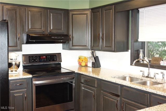 3545 Malley Ave, Coventry Township, OH 44319 - kitchen with stainless steel range with electric stovetop, ventilation hood, dark brown cabinetry, and light stone countertops