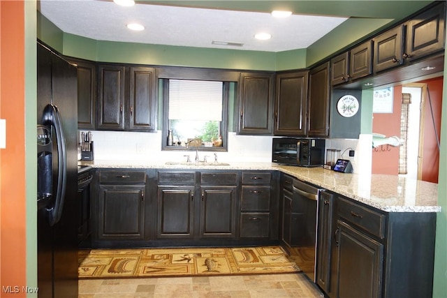 3545 Malley Ave, Coventry Township, OH 44319 - kitchen featuring black appliances, light stone counters, decorative backsplash, a peninsula, and dark brown cabinetry