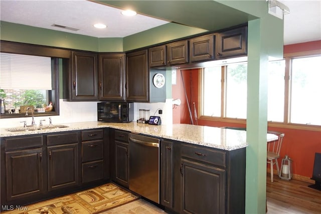 3545 Malley Ave, Coventry Township, OH 44319 - kitchen with stainless steel dishwasher, black microwave, plenty of natural light, and dark brown cabinetry