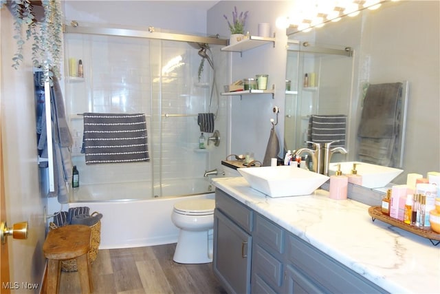 3545 Malley Ave, Coventry Township, OH 44319 - bathroom with vanity, wood finished floors, and combined bath / shower with glass door