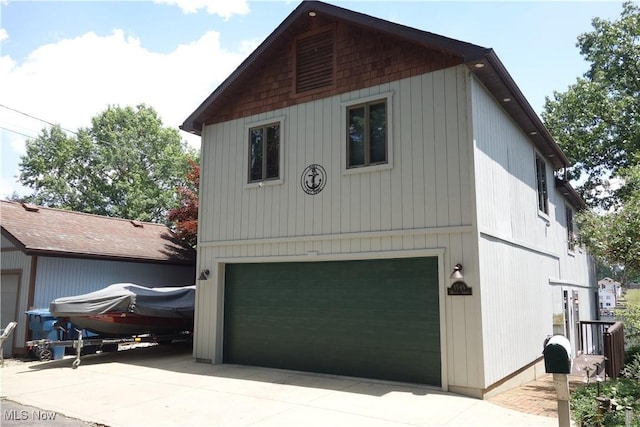 3545 Malley Ave, Coventry Township, OH 44319 - view of side of property featuring a garage and driveway
