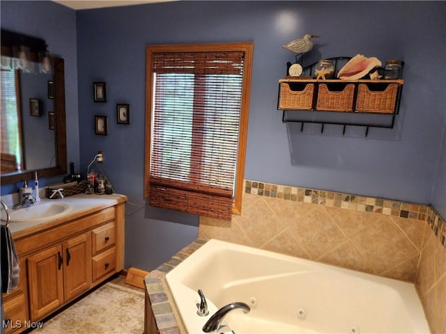 3545 Malley Ave, Coventry Township, OH 44319 - bathroom featuring vanity and a jetted tub