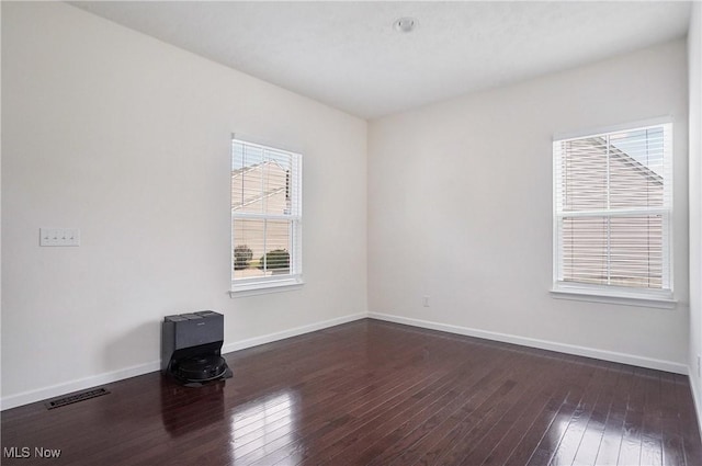 120 Glenridge Cir, Tallmadge, OH 44278 - unfurnished room with a wood stove and dark wood finished floors