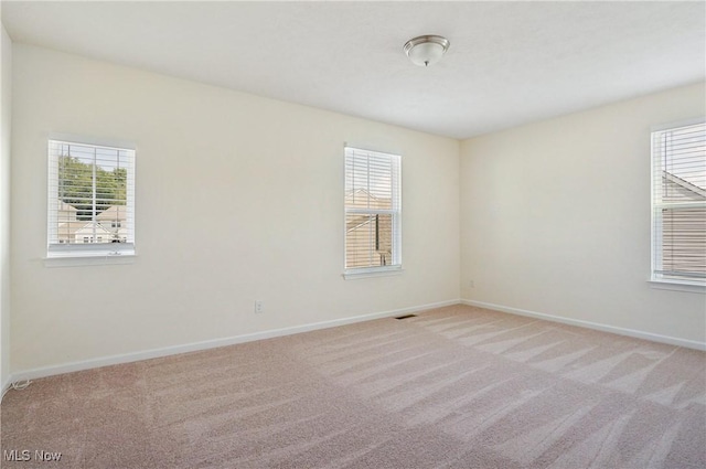 120 Glenridge Cir, Tallmadge, OH 44278 - empty room featuring healthy amount of natural light and light carpet