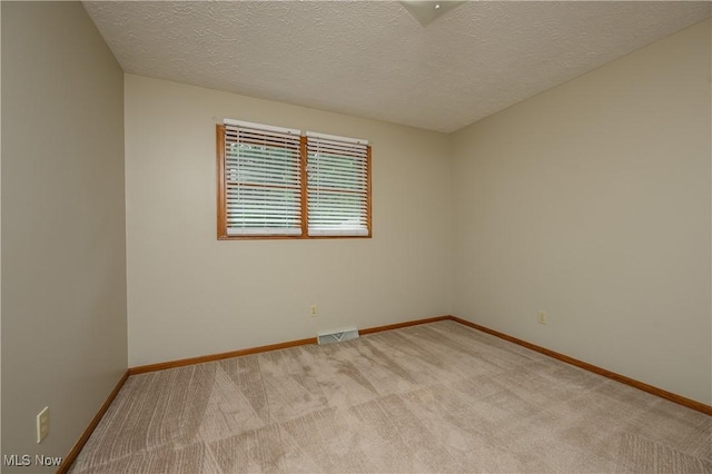 6104 Shipslanding Ave NW, Canton, OH 44718 - carpeted spare room featuring a textured ceiling and baseboards