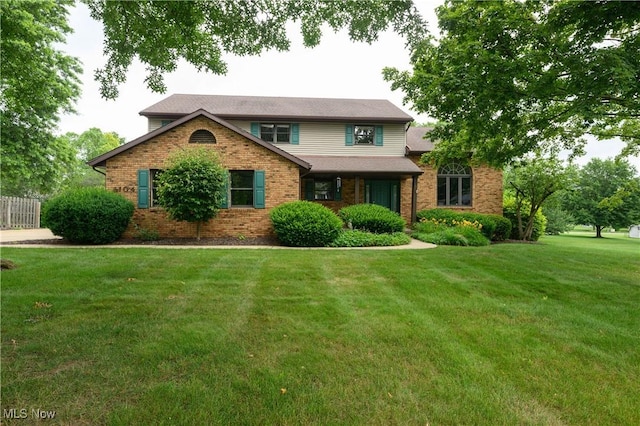 6104 Shipslanding Ave NW, Canton, OH 44718 - view of front of house with a front yard and brick siding