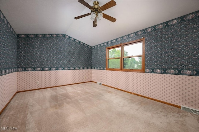 6104 Shipslanding Ave NW, Canton, OH 44718 - carpeted empty room featuring wallpapered walls, a ceiling fan, and vaulted ceiling