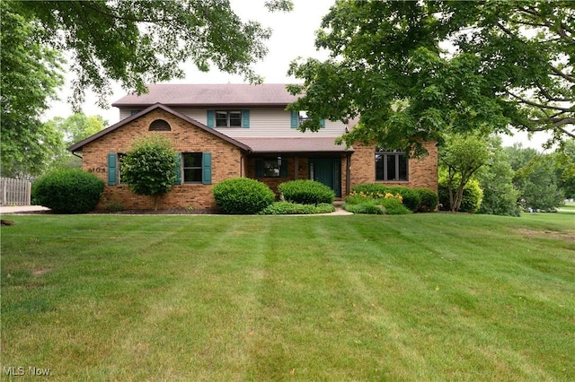 6104 Shipslanding Ave NW, Canton, OH 44718 - view of front of home featuring brick siding and a front lawn