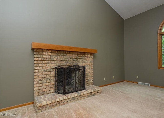 6104 Shipslanding Ave NW, Canton, OH 44718 - unfurnished living room with vaulted ceiling, a fireplace, and carpet floors