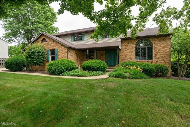6104 Shipslanding Ave NW, Canton, OH 44718 - view of front of house featuring brick siding and a front yard