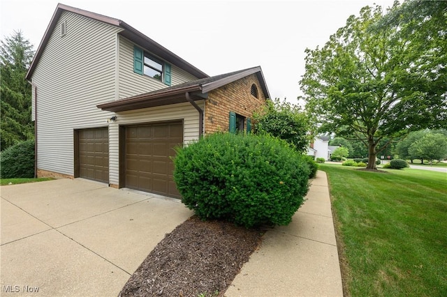 6104 Shipslanding Ave NW, Canton, OH 44718 - view of property exterior with a lawn, a garage, and concrete driveway
