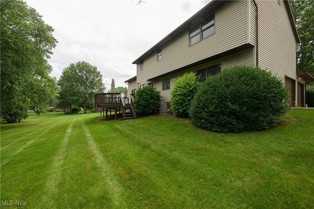 6104 Shipslanding Ave NW, Canton, OH 44718 - view of green lawn with a wooden deck