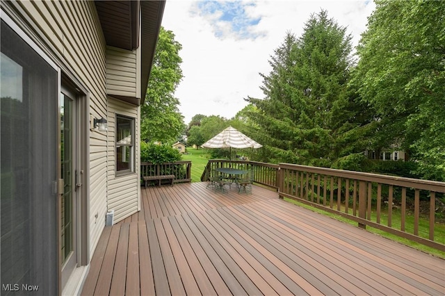6104 Shipslanding Ave NW, Canton, OH 44718 - deck featuring outdoor dining area and view of wooded area