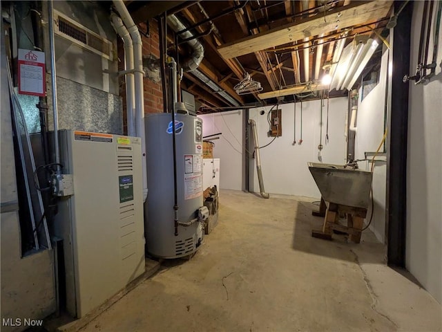 7567 Inland Dr, Olmsted Falls, OH 44138 - unfinished basement featuring gas water heater and heating unit