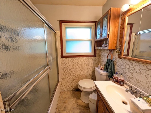 7567 Inland Dr, Olmsted Falls, OH 44138 - full bathroom featuring vanity, enclosed tub / shower combo, and stone finish flooring