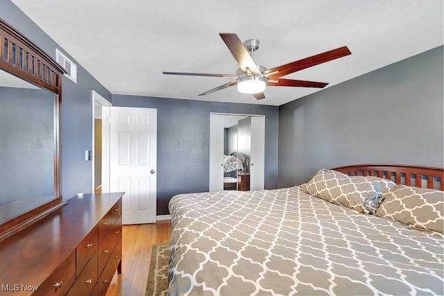 5982 Forest Ridge Dr, North Olmsted, OH 44070 - bedroom with light wood-type flooring, a closet, and ceiling fan