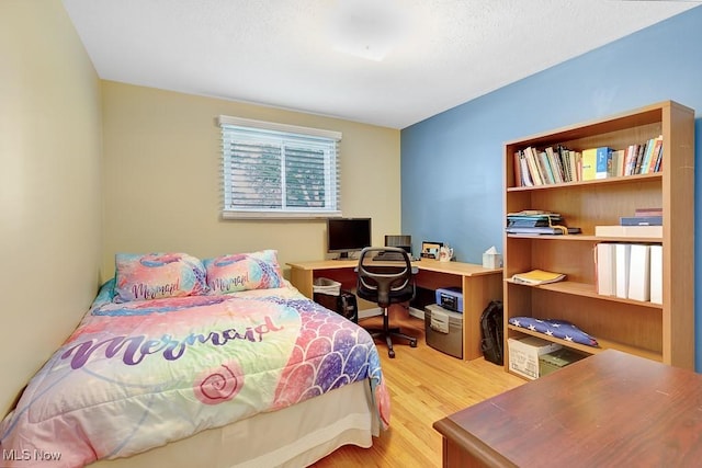 5982 Forest Ridge Dr, North Olmsted, OH 44070 - bedroom featuring light wood-style flooring and an office area