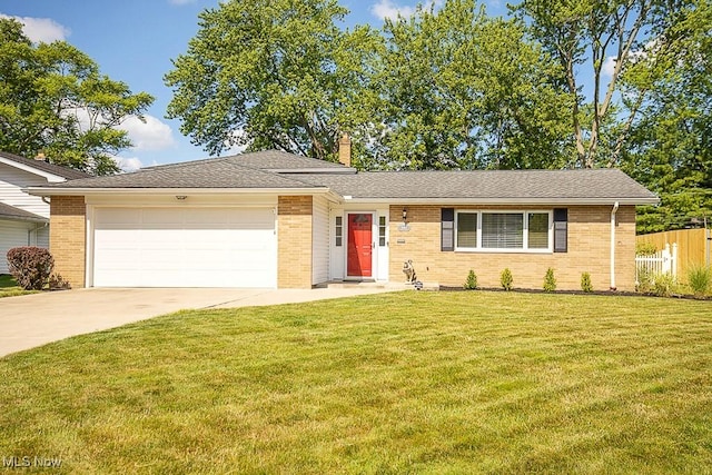 5982 Forest Ridge Dr, North Olmsted, OH 44070 - ranch-style home with a garage, driveway, brick siding, and a chimney