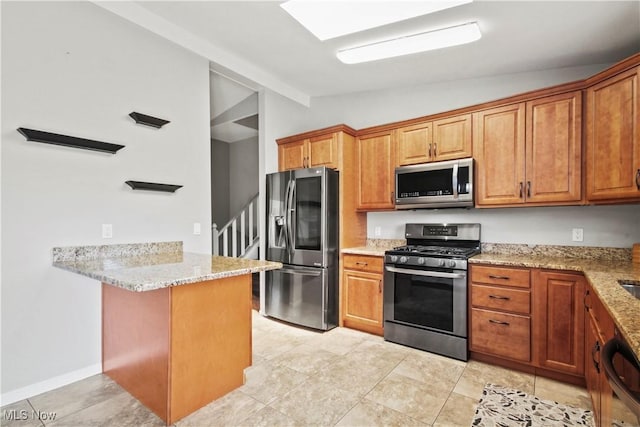 3700 Meander Reserve Cir, Canfield, OH 44406 - kitchen featuring stainless steel appliances, vaulted ceiling, a peninsula, light stone countertops, and brown cabinetry