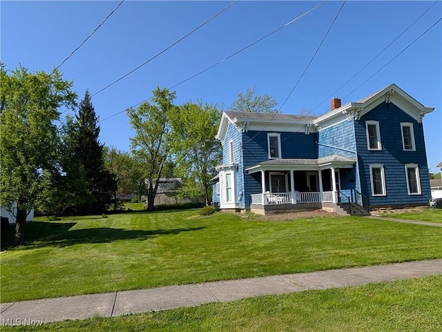 136 W Church St, Newton Falls, OH 44444 - italianate house featuring a porch, a front yard, and a chimney
