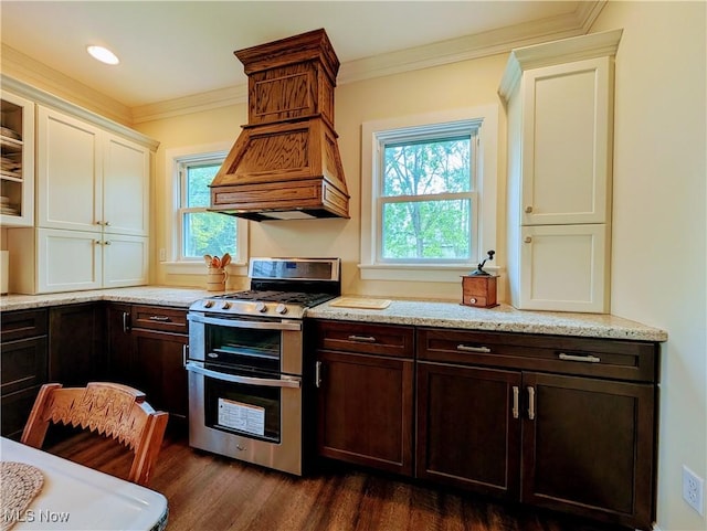 136 W Church St, Newton Falls, OH 44444 - kitchen featuring range with two ovens, healthy amount of natural light, dark wood-style flooring, dark brown cabinetry, and ornamental molding