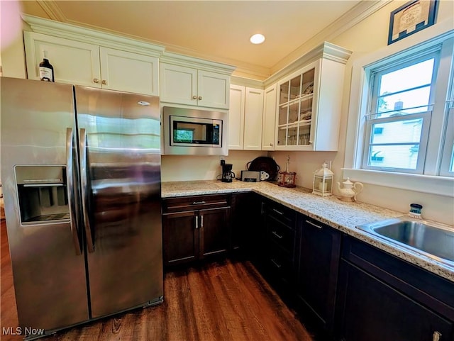 136 W Church St, Newton Falls, OH 44444 - kitchen featuring appliances with stainless steel finishes, dark wood-style floors, glass insert cabinets, light stone countertops, and white cabinetry