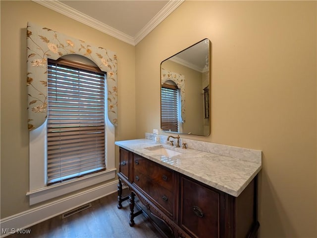 136 W Church St, Newton Falls, OH 44444 - bathroom featuring wood finished floors, crown molding, and vanity