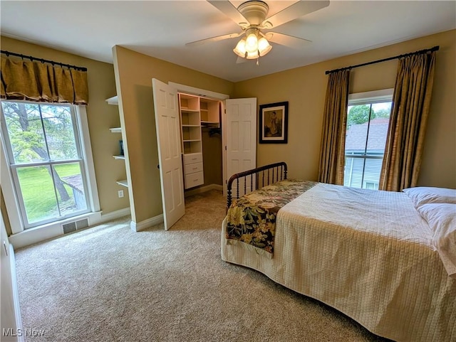 136 W Church St, Newton Falls, OH 44444 - bedroom featuring light carpet, a walk in closet, a closet, and ceiling fan