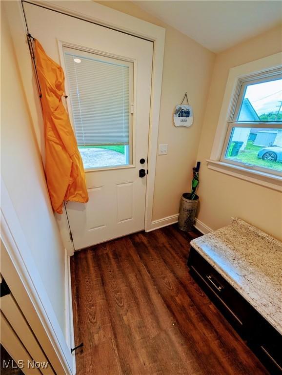 136 W Church St, Newton Falls, OH 44444 - doorway to outside with wood finished floors and baseboards