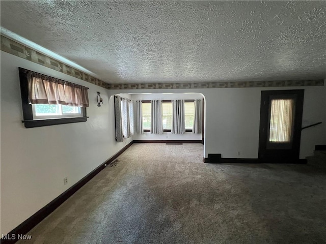 3731 Washington Park Blvd, Newburgh Heights, OH 44105 - carpeted empty room featuring a textured ceiling and baseboards