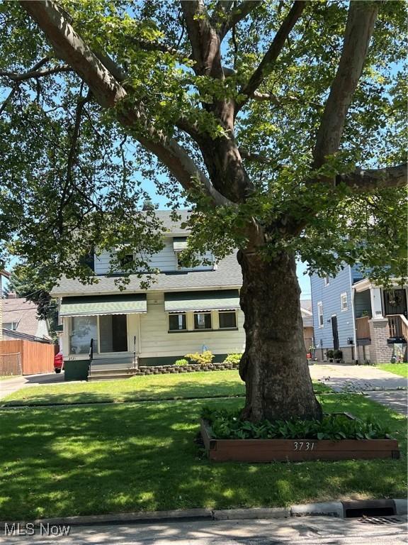 3731 Washington Park Blvd, Newburgh Heights, OH 44105 - obstructed view of property featuring roof with shingles