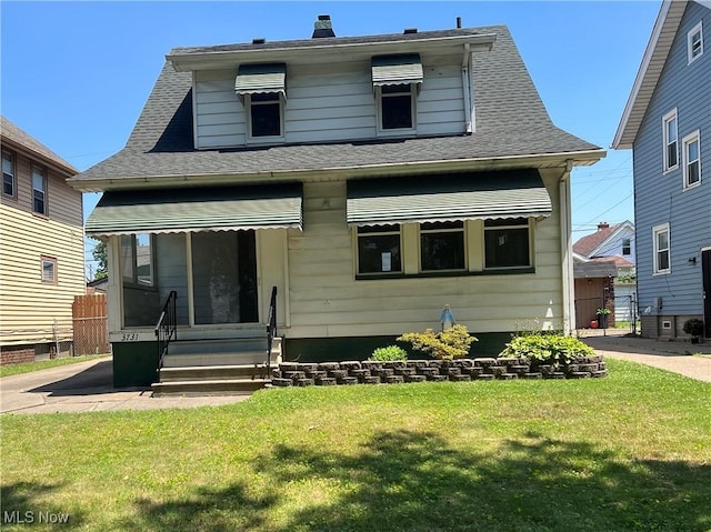 3731 Washington Park Blvd, Newburgh Heights, OH 44105 - bungalow-style home with a front lawn and a shingled roof