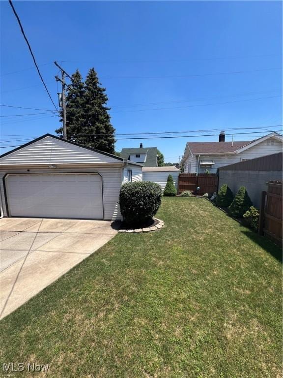 3731 Washington Park Blvd, Newburgh Heights, OH 44105 - view of yard featuring an outdoor structure and a garage