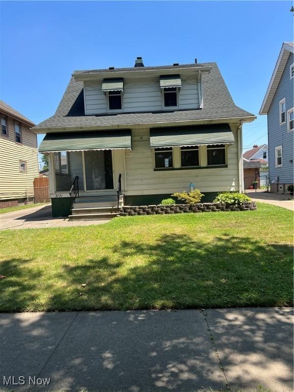 3731 Washington Park Blvd, Newburgh Heights, OH 44105 - bungalow featuring a front yard and roof with shingles