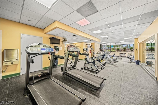 140 Fox Hollow Dr Unit 206C, Mayfield Heights, OH 44124 - workout area with a paneled ceiling and baseboards