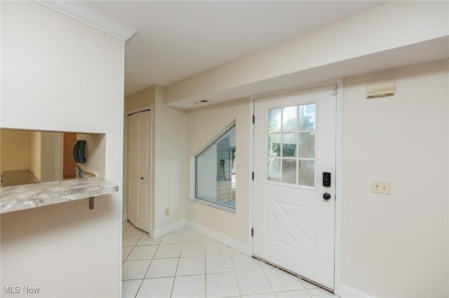 6131 Center St Unit 106, Mentor, OH 44060 - doorway featuring light tile patterned flooring and baseboards