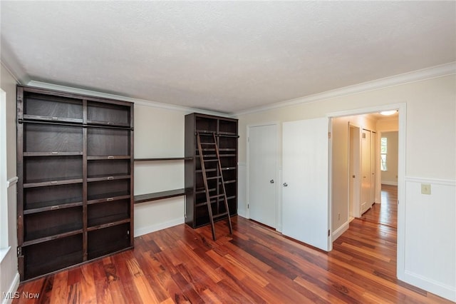6131 Center St Unit 106, Mentor, OH 44060 - unfurnished bedroom featuring wood finished floors and ornamental molding