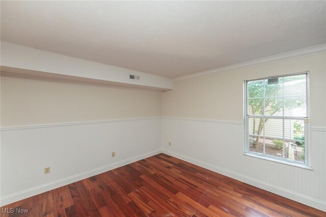 6131 Center St Unit 106, Mentor, OH 44060 - spare room featuring wood finished floors and crown molding