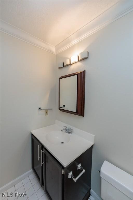 6131 Center St Unit 106, Mentor, OH 44060 - bathroom with vanity, ornamental molding, and tile patterned floors