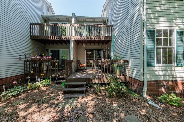 6131 Center St Unit 106, Mentor, OH 44060 - rear view of property featuring a wooden deck and a balcony